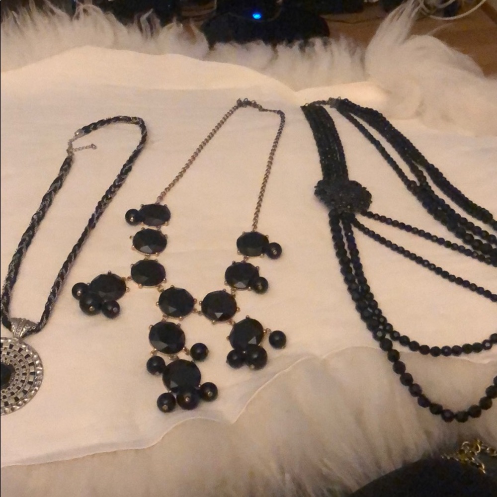 Multiple black strand necklaces